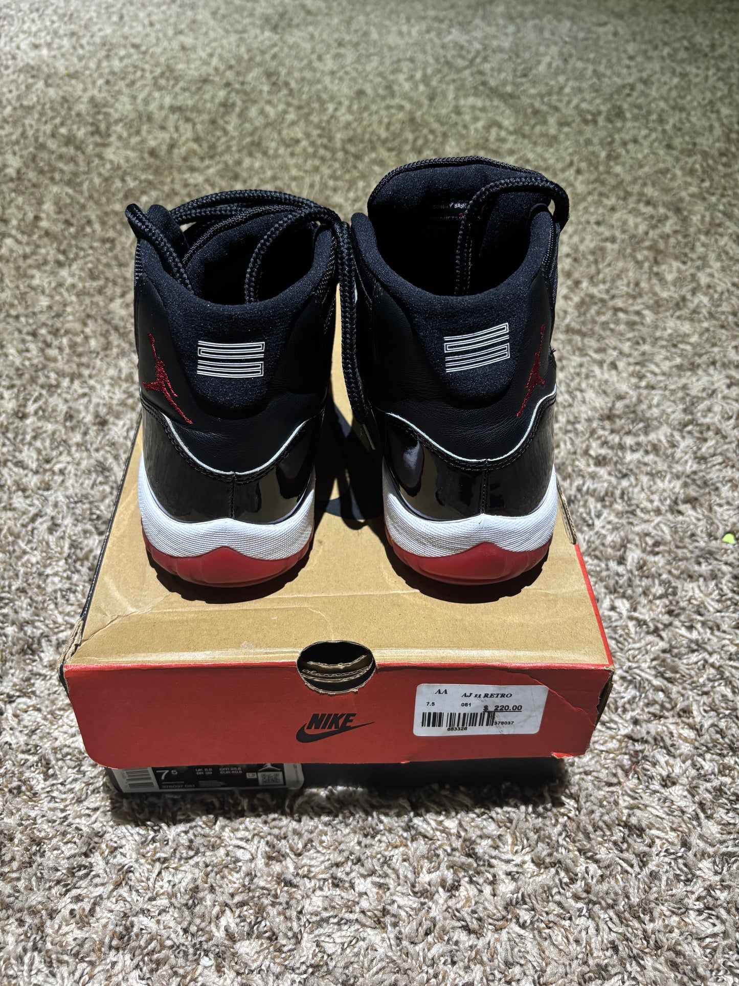 Air Jordan 11 Retro "Bred" Black/Red - Size 7'5 (Used)